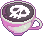 A pixel latte in a pink-grey mug with a skull inside.